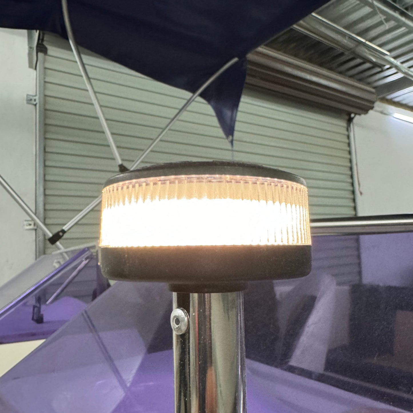360-degree LED stern navigation light installed on a boat, providing all-round white illumination for improved visibility and safe night-time navigation.