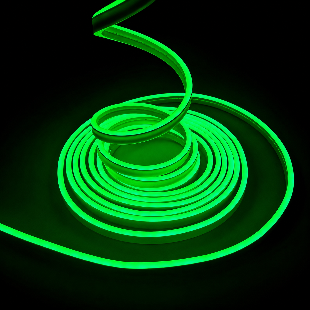 A coiled green LED neon light strip glowing brightly against a solid black background.