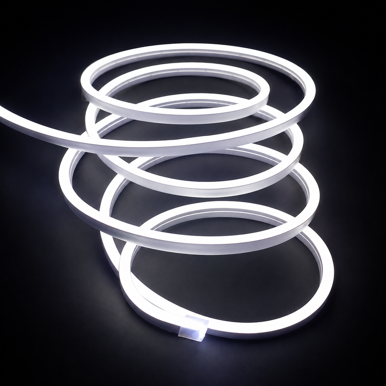A coiled white LED neon light strip on a solid black background, showcasing its flexible, glowing tubing.
