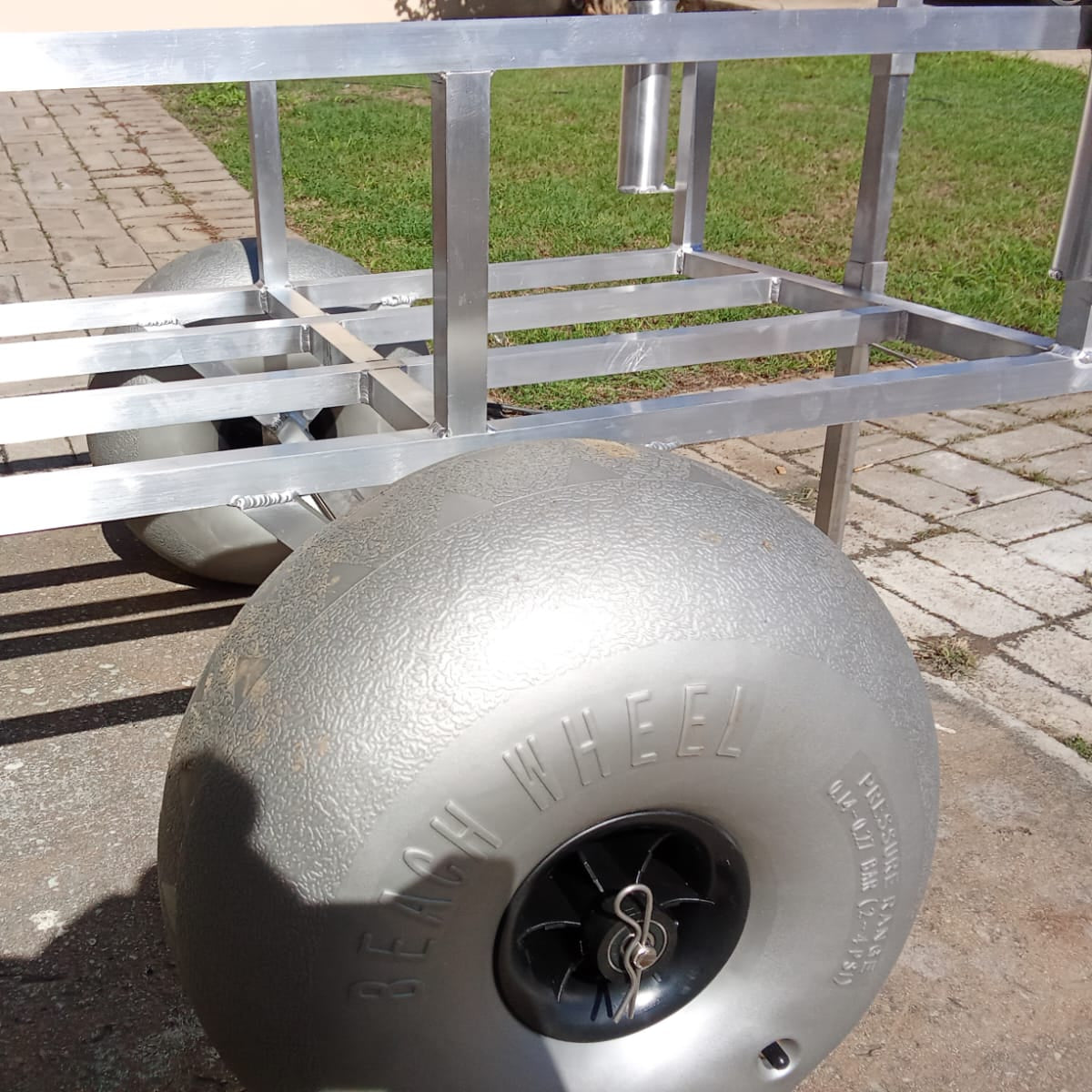 Close up of the beach wheels on the 2 wheel beach trolley