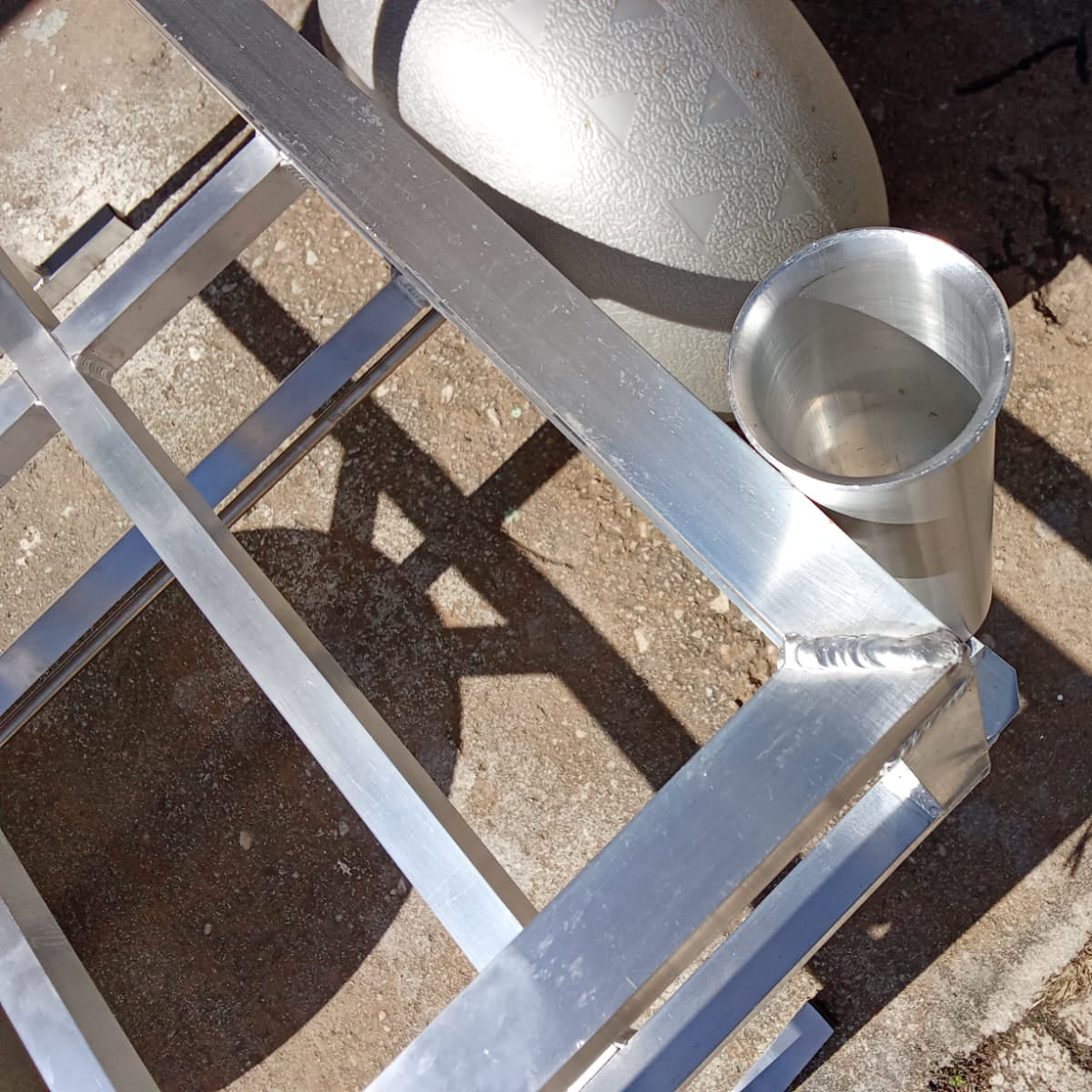 Close up of the rod holders and beach wheels on the 2 wheel beach trolley