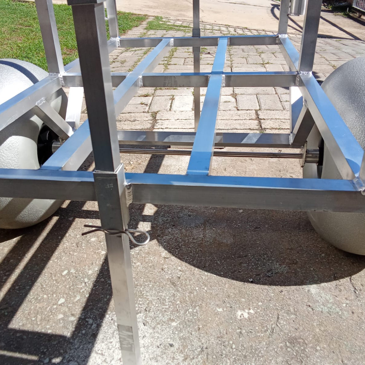 Close up of the rod holders and beach wheels on the 2 wheel beach trolley