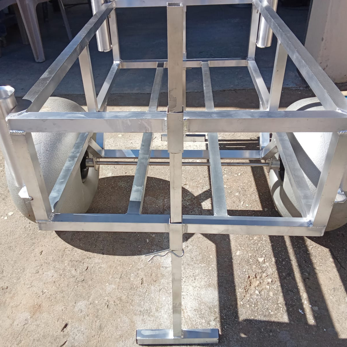 Close up of the rod holders and beach wheels on the 2 wheel beach trolley