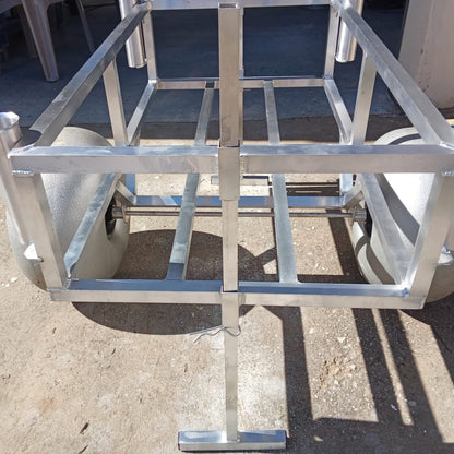 Close up of the rod holders and beach wheels on the 2 wheel beach trolley