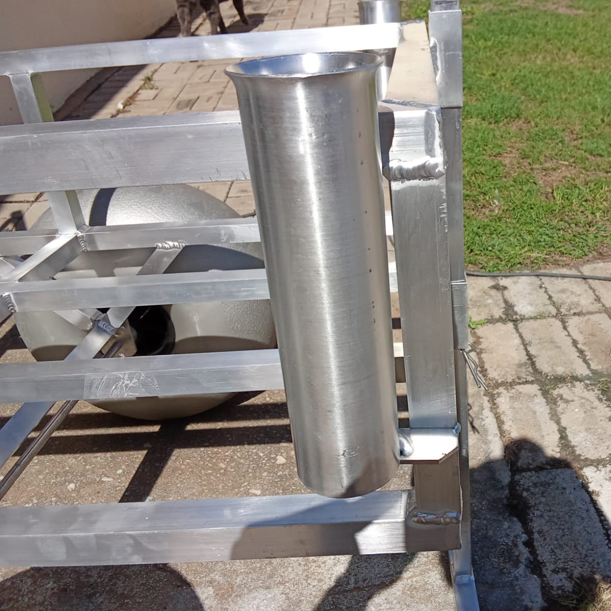 Close up of the rod holders and beach wheels on the 2 wheel beach trolley