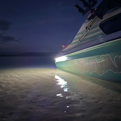 Boat on a beach at night with 'Interflax' branding.