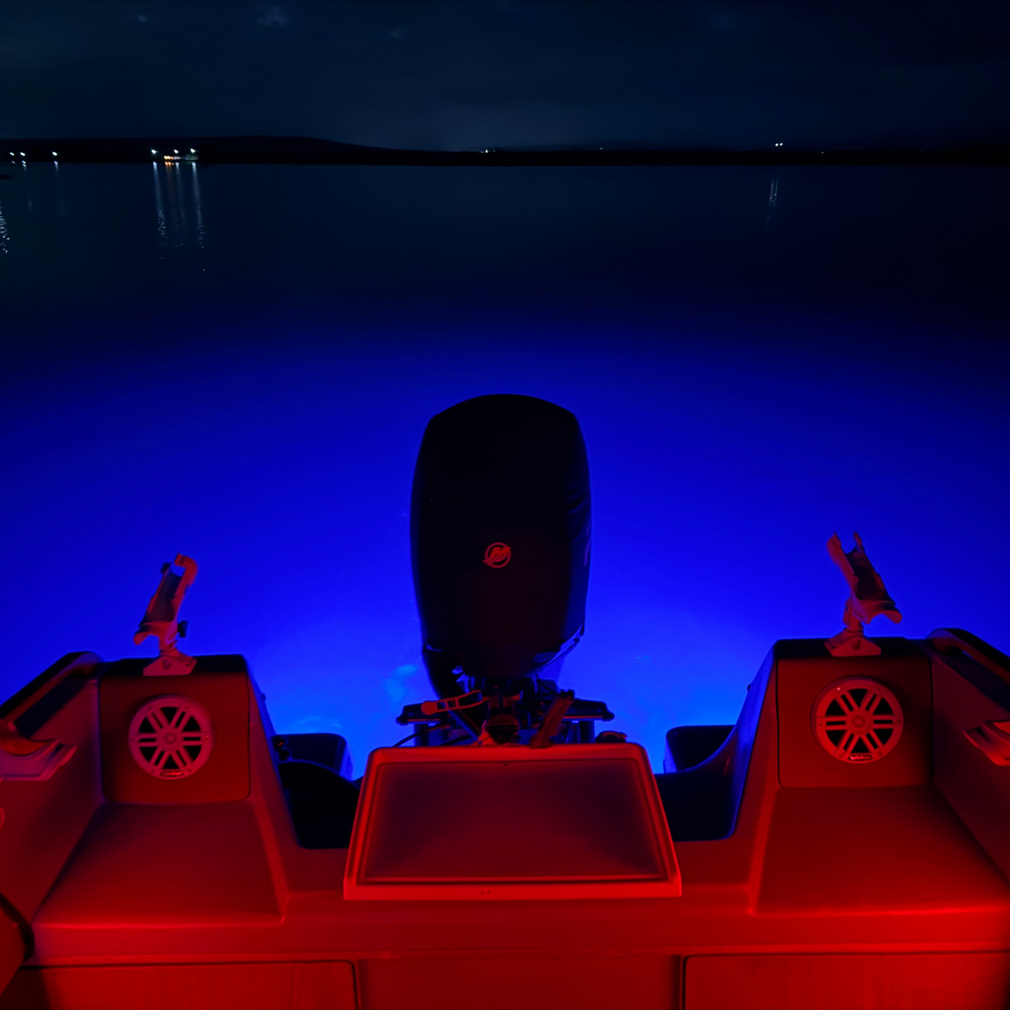 Boat with red lights on a dark water surface