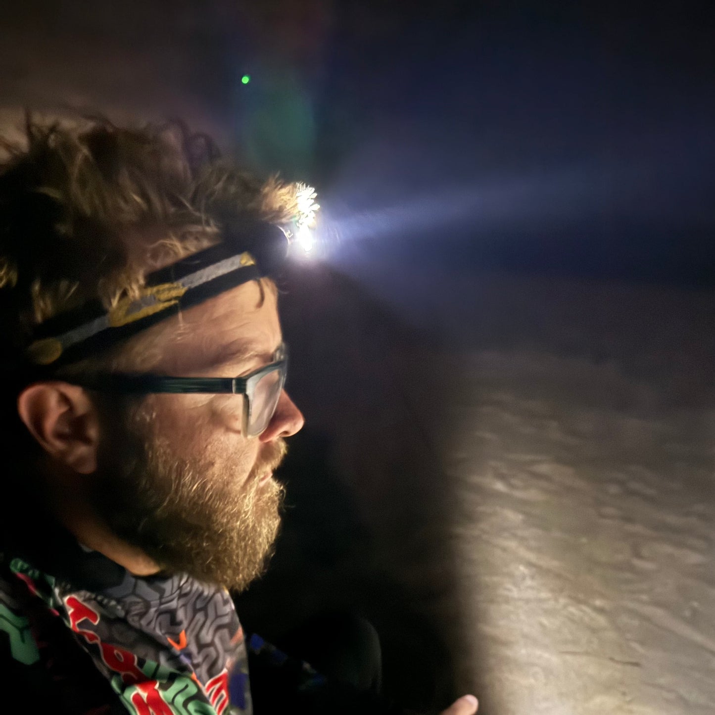 Person wearing a blast 5 led headlamp surf fishing 