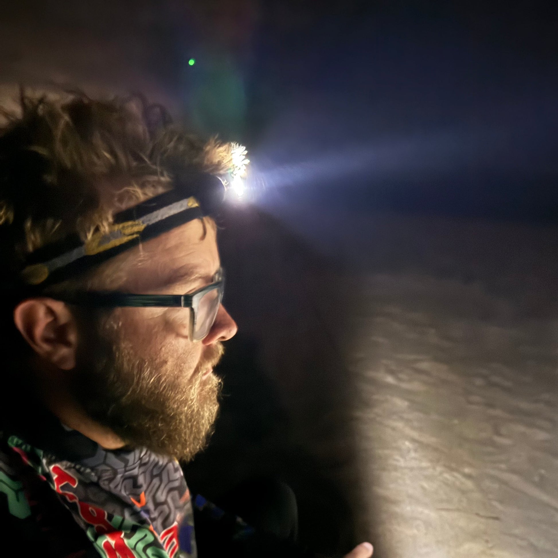 Person wearing a blast 5 led headlamp surf fishing 