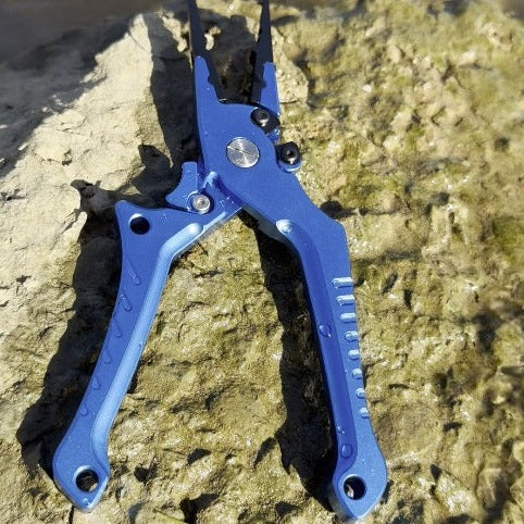 Salt power fit pliers in blue on a rock at gamtoos