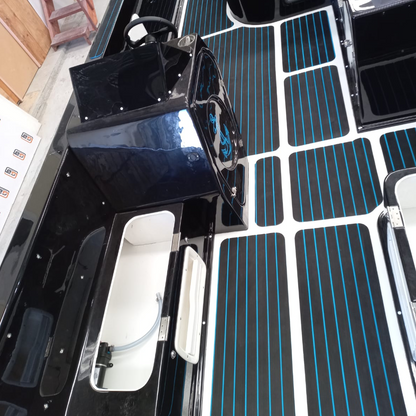 Blue and black EVA decking installed on a custom boat deck