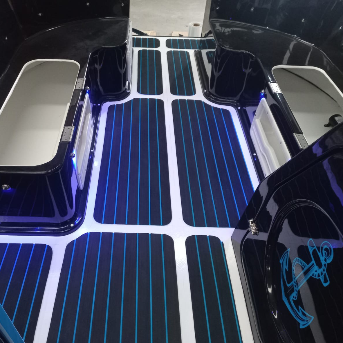 Blue and black EVA decking installed on a boat walkway