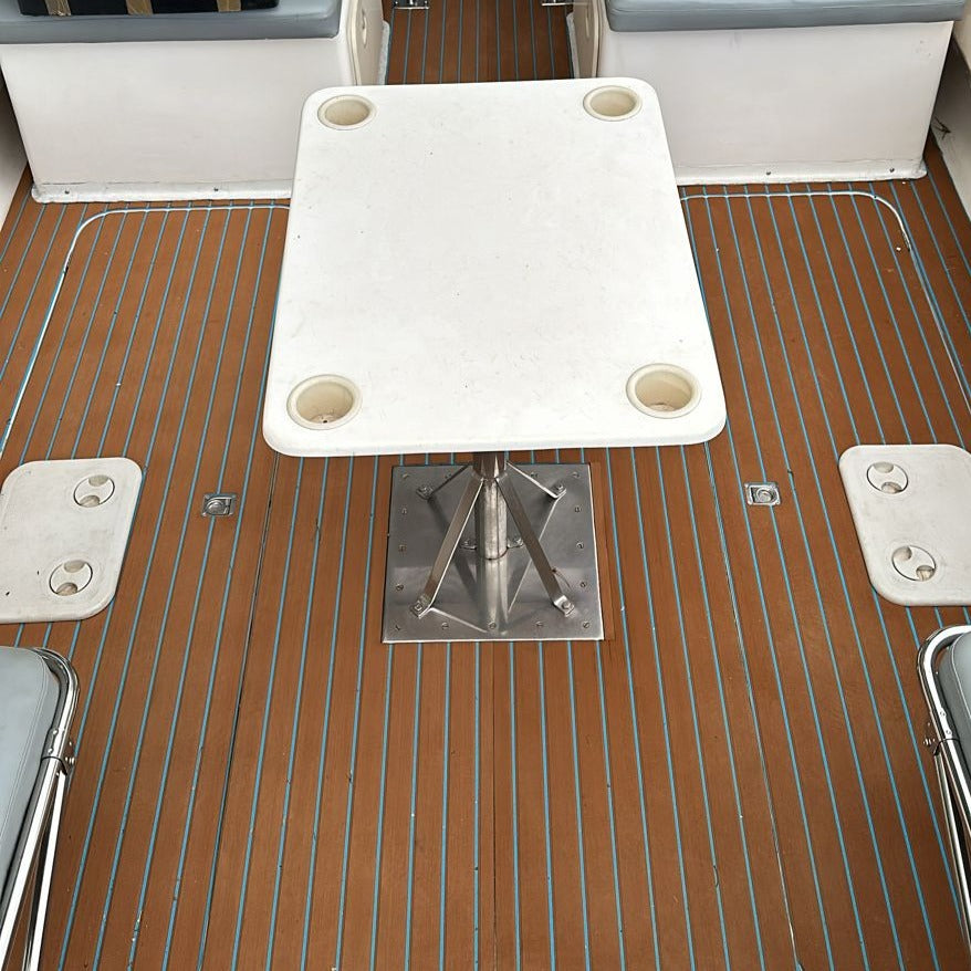 Brown and blue EVA decking installed in a boat cockpit