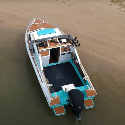 Brown EVA decking installed on a cabin fishing boat with custom deck panels