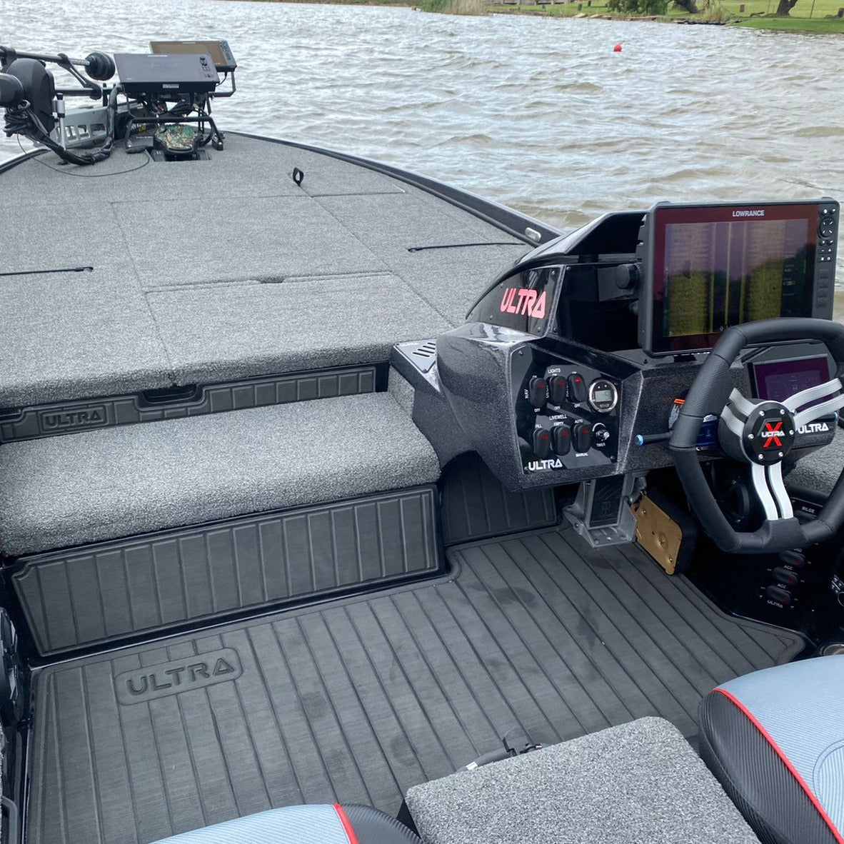 Dark grey EVA decking installed on a bass boat with non-slip marine flooring and storage hatch covers