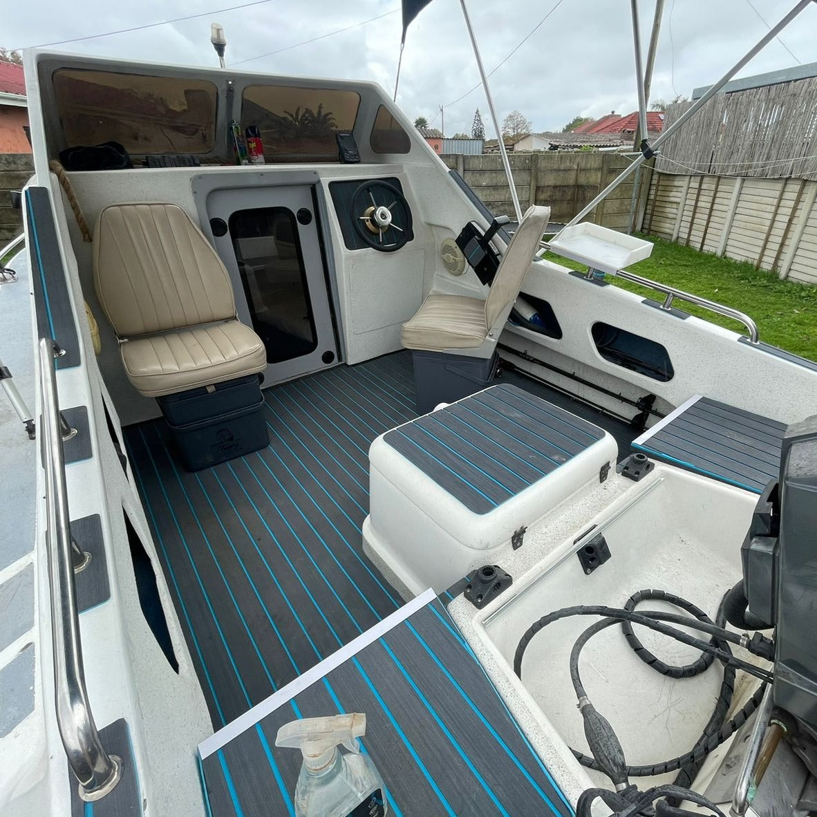Grey and blue EVA decking installed in a cabin fishing boat cockpit