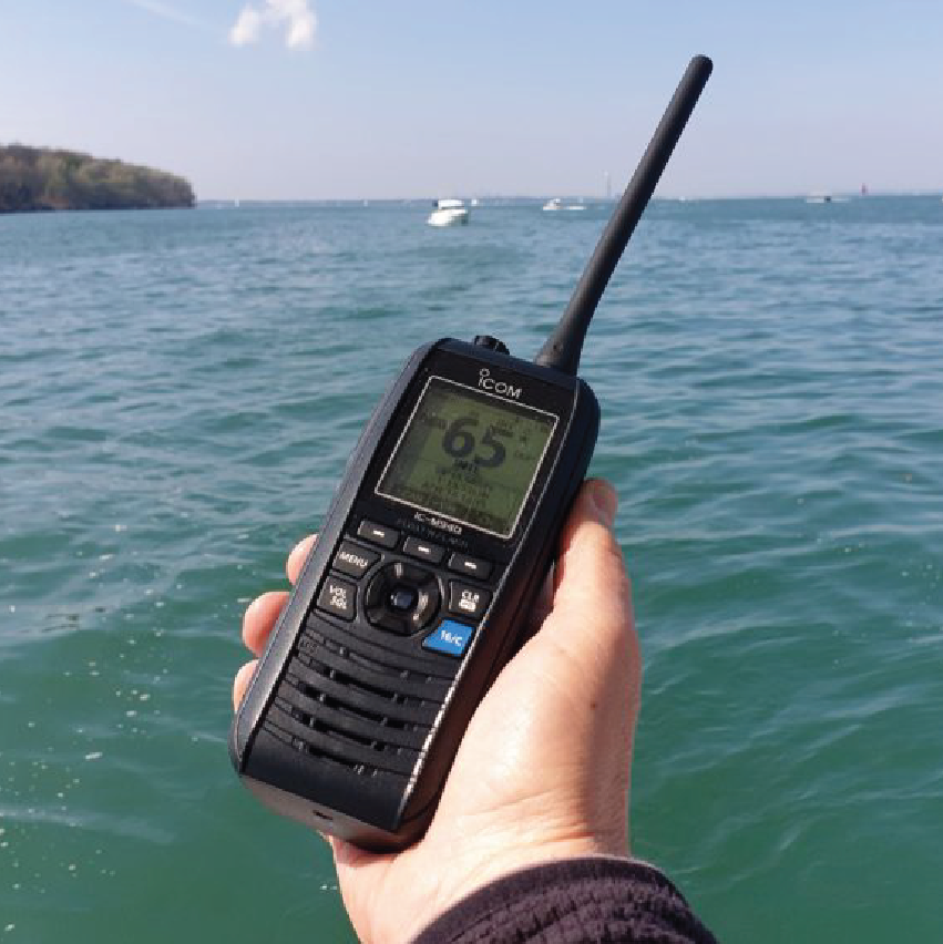 Icom IC-M37 handheld marine VHF radio in use on the water, providing reliable waterproof communication for boating, fishing and other marine activities.