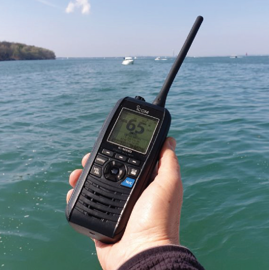 Icom IC-M37 handheld marine VHF radio in use on the water, providing reliable waterproof communication for boating, fishing and other marine activities.