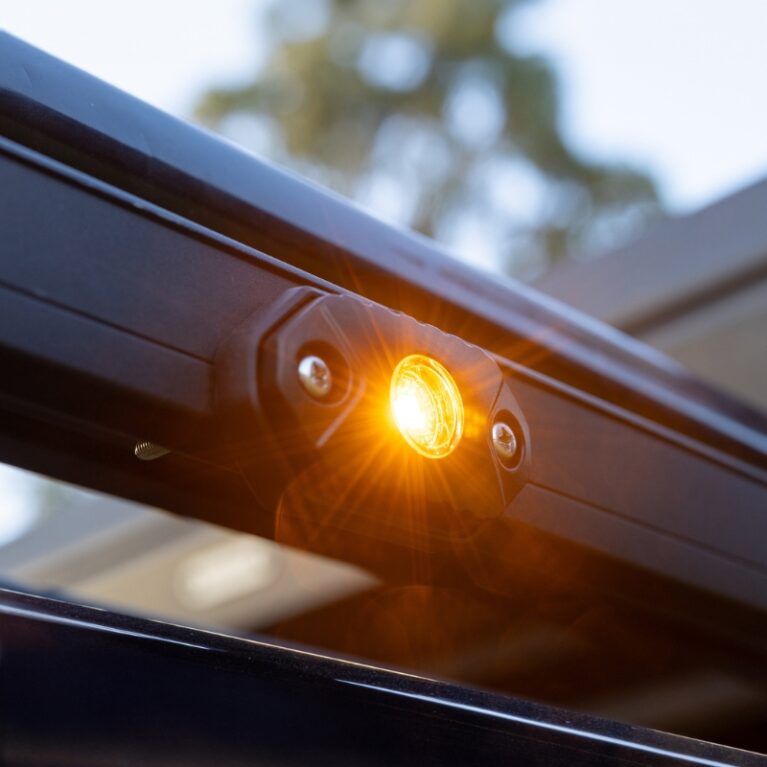 Amber marine courtesy rock LED light mounted on a boat, providing bright low-level illumination for decks, steps, compartments and cockpit areas.
