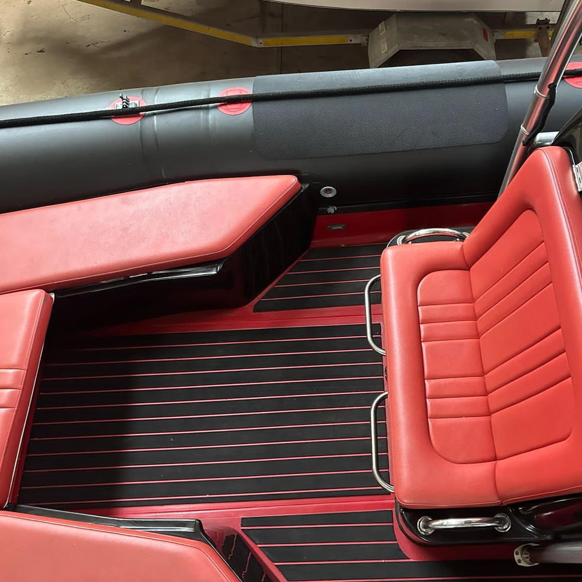 Red and black EVA decking installed on an inflatable boat floor