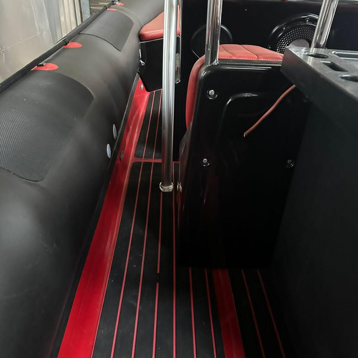 Red and black EVA decking installed on a RIB side walkway