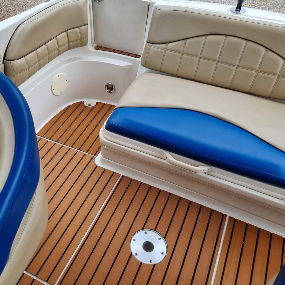 Teak style EVA decking installed in a boat cockpit